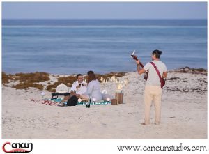 Romantic Cancun Picnic on the beach with musician